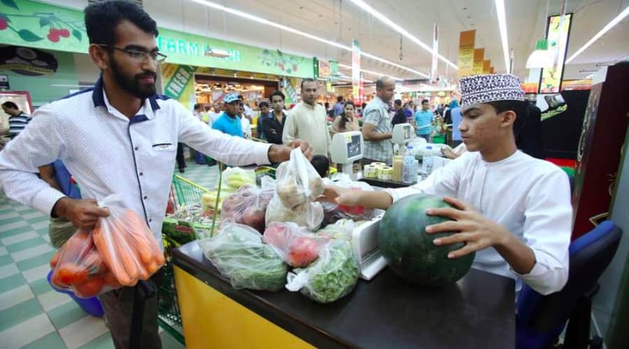 omani shop at supermarket - plastic bags - afp photo